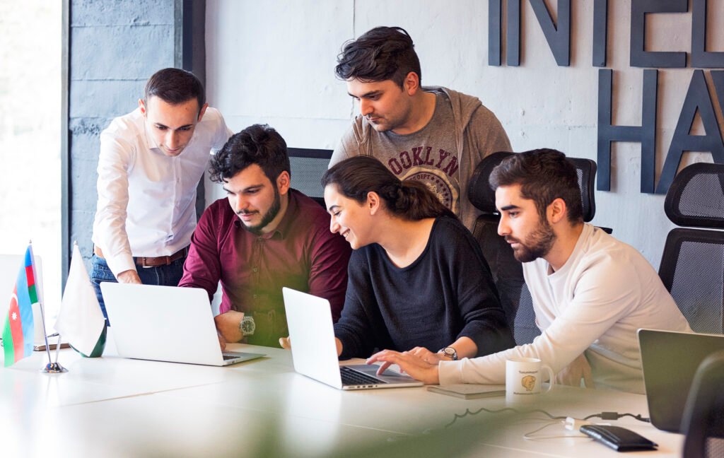 Invoxen team collaborating on innovative AI, web, and cloud solutions — showcasing Invoxen Services as your trusted technology partner